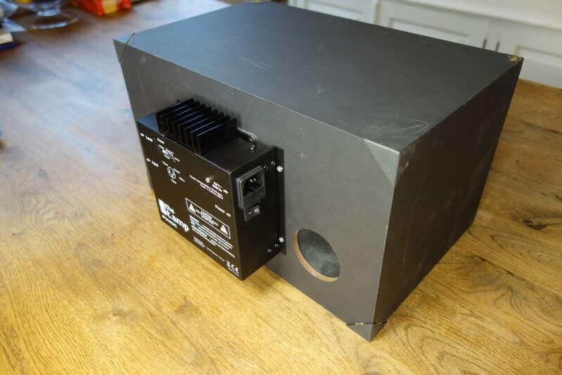 Monitor speaker with attached power amplifier module.