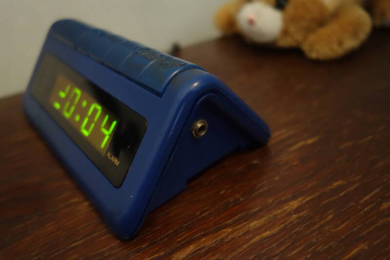 Alarm clock with connector on the side
