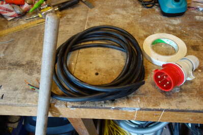 broom handle, wire and plug, cloth tape